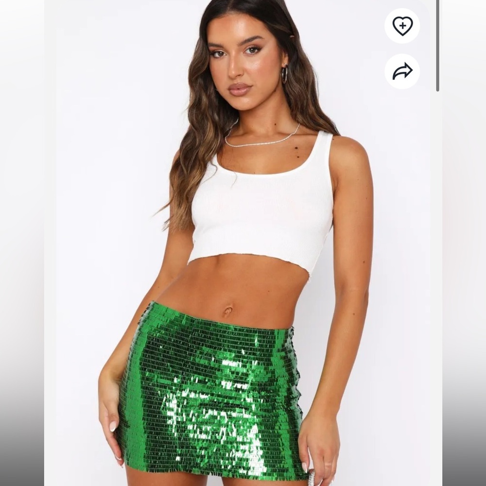 White fox show off a little sequin mini skirt